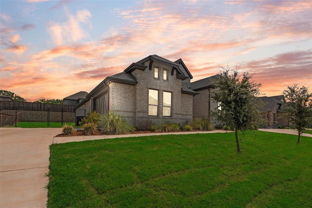 704 Toby Trail Mansfield, TX 76063 - Photo 4 of 40 View of front of home with brick siding and driveway