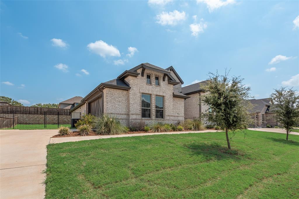 704 Toby Trail Mansfield, TX 76063 - Photo 5 of 40 View of front of home featuring brick siding and driveway