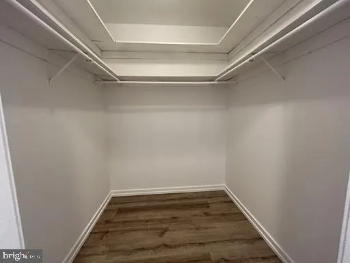 a bathroom with a granite countertop shower and a toilet