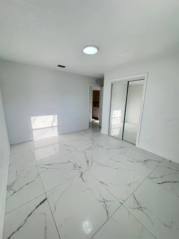 an empty room with a bathroom