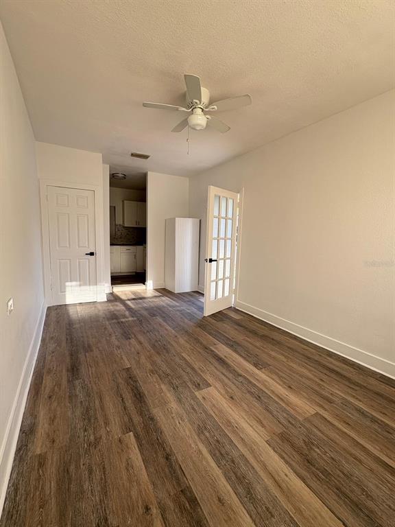 723 Fairmount Road Daytona Beach, FL 32114 - Photo 7 of 9 wooden floor in an empty room with a window