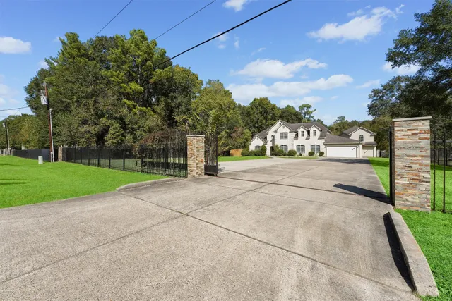 a view of a street with a houses in the background