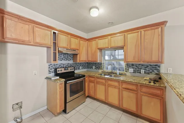 a view of an empty room with windows