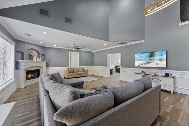 a living room with furniture and a fireplace