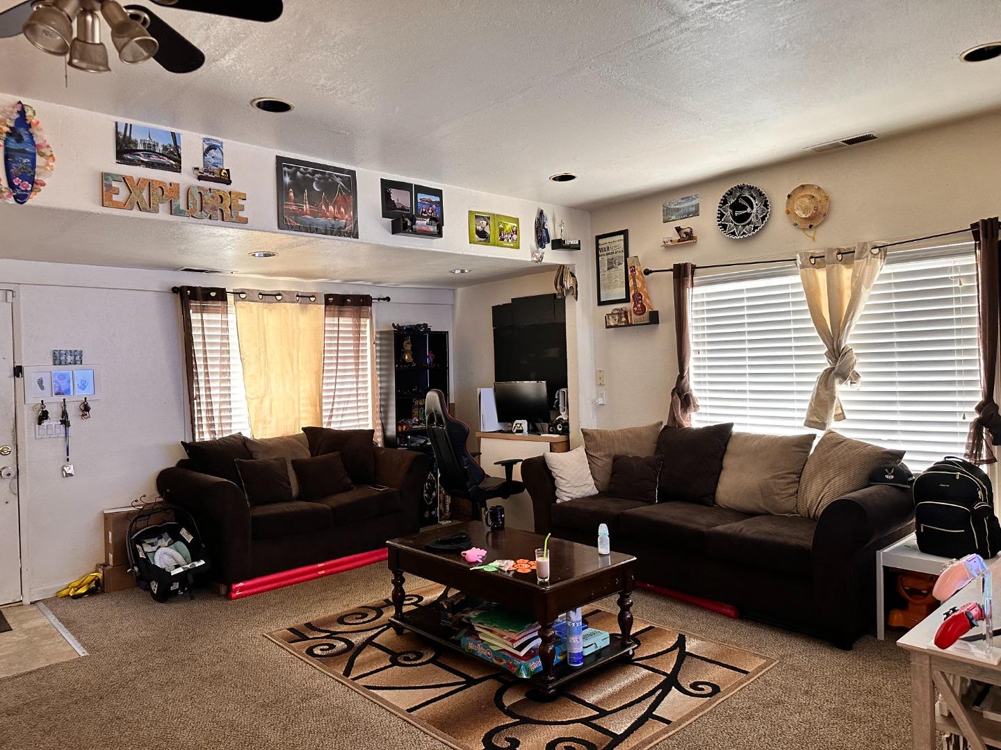 323 Maple Street Salinas, CA 93901 - Photo 13 of 15 a living room with furniture gym equipment and a window
