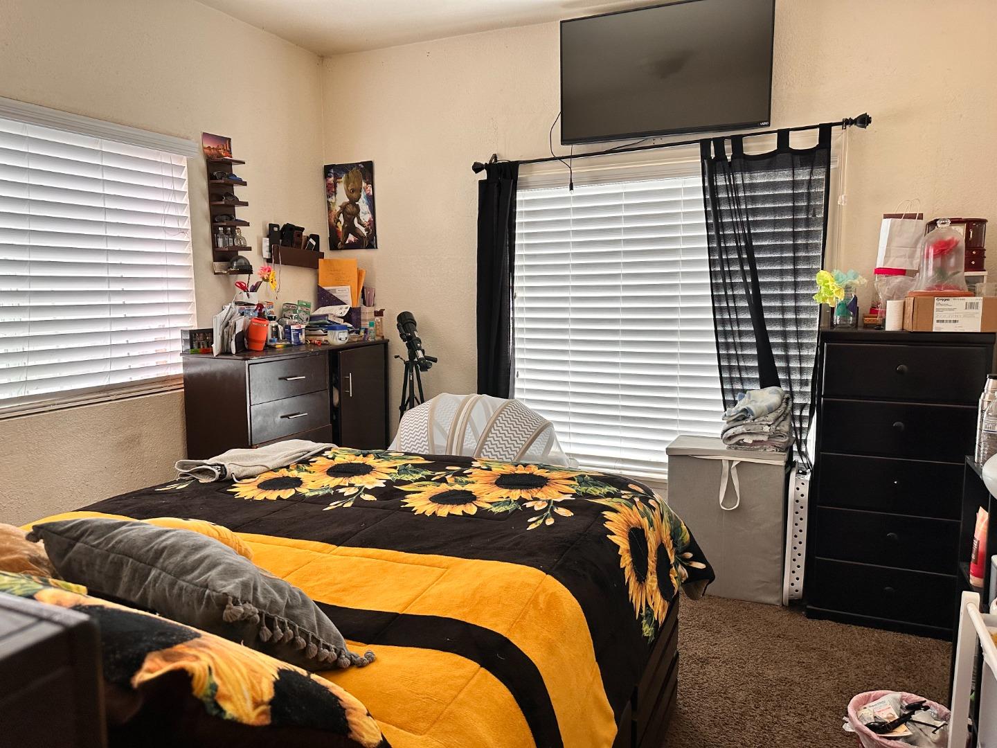 323 Maple Street Salinas, CA 93901 - Photo 4 of 15 a bedroom with a bed and a dresser