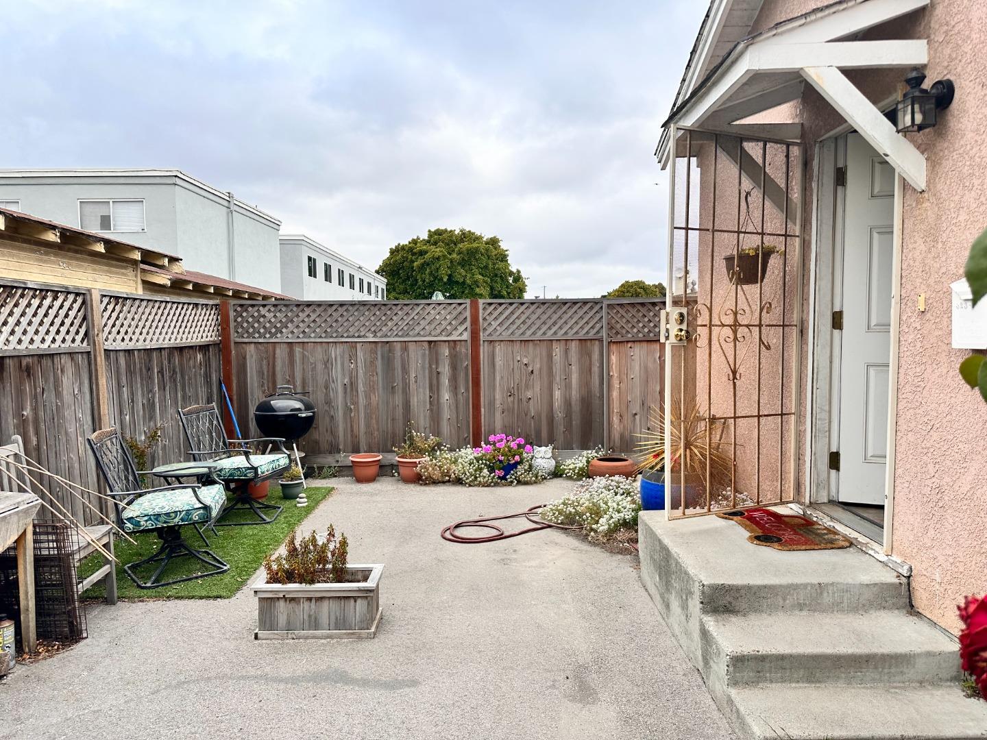 323 Maple Street Salinas, CA 93901 - Photo 6 of 15 a backyard with table and chairs