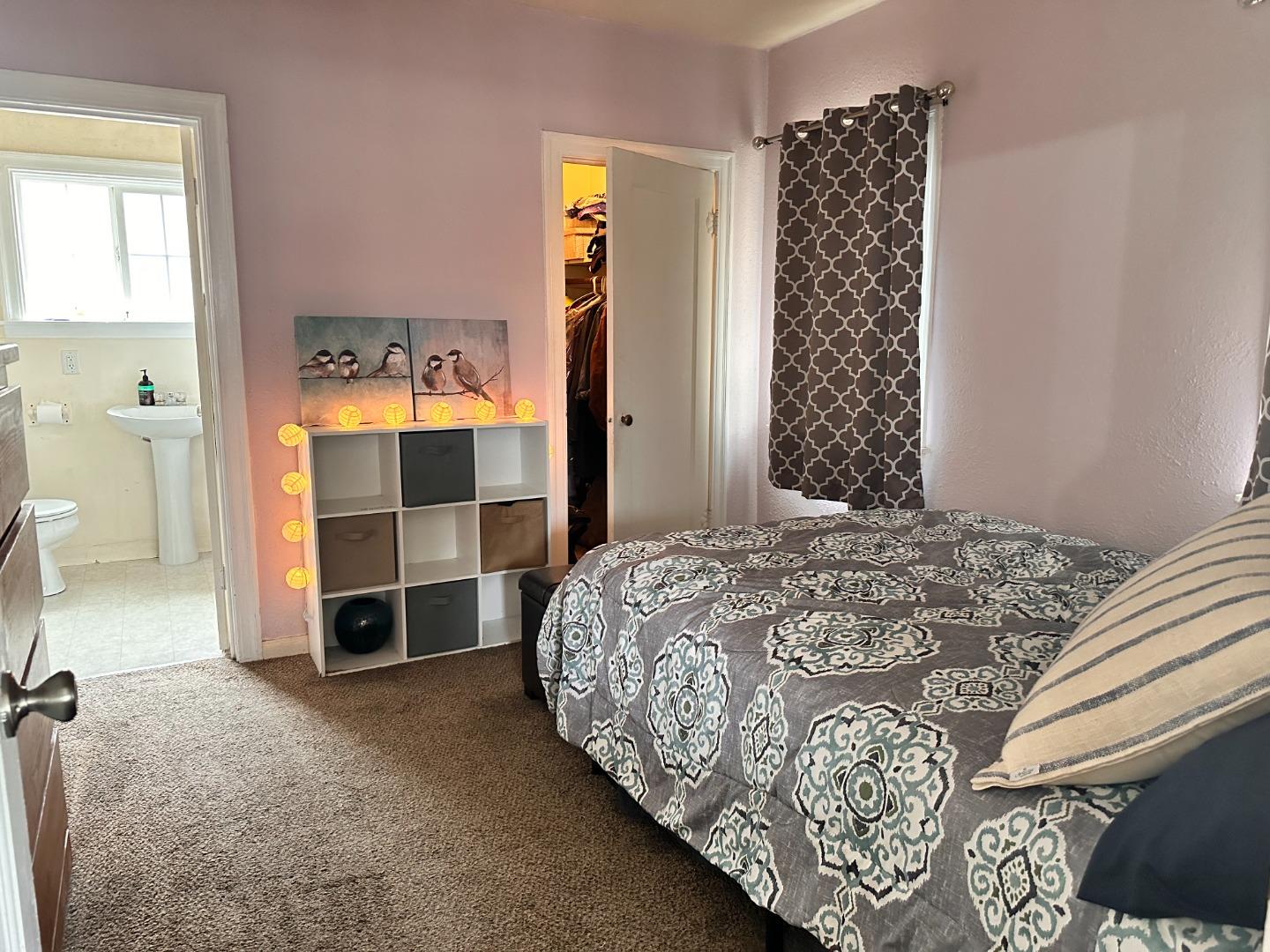 323 Maple Street Salinas, CA 93901 - Photo 9 of 15 a bedroom with a bed and a window