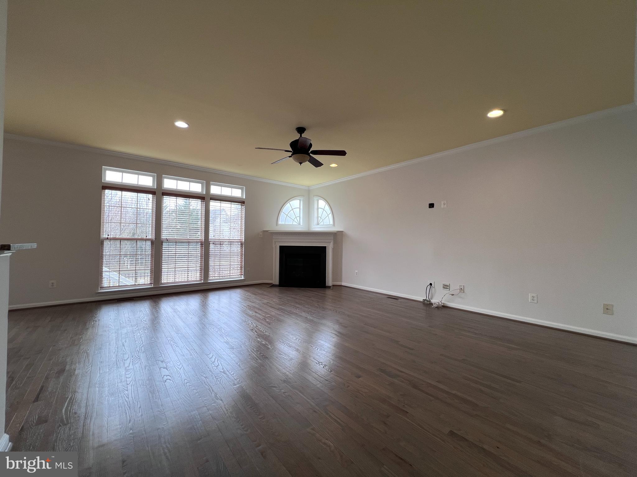 3925 Beeker Mill Place Chantilly, VA 20151 - Photo 12 of 40 a view of an empty room with wooden floor and a window