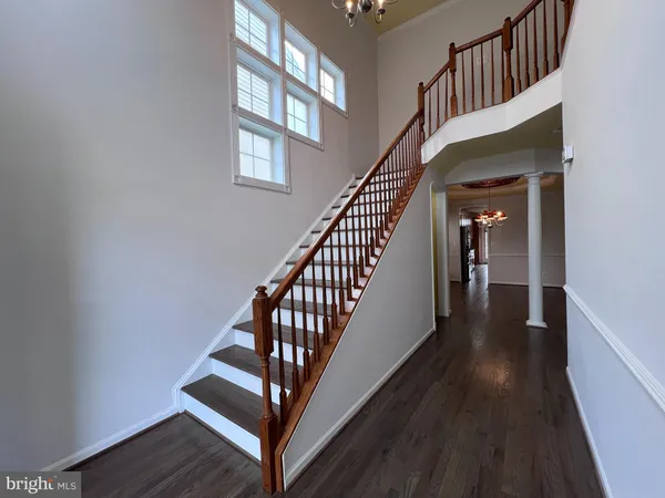 a kitchen with stainless steel appliances granite countertop wooden cabinets a stove top oven a sink and dishwasher