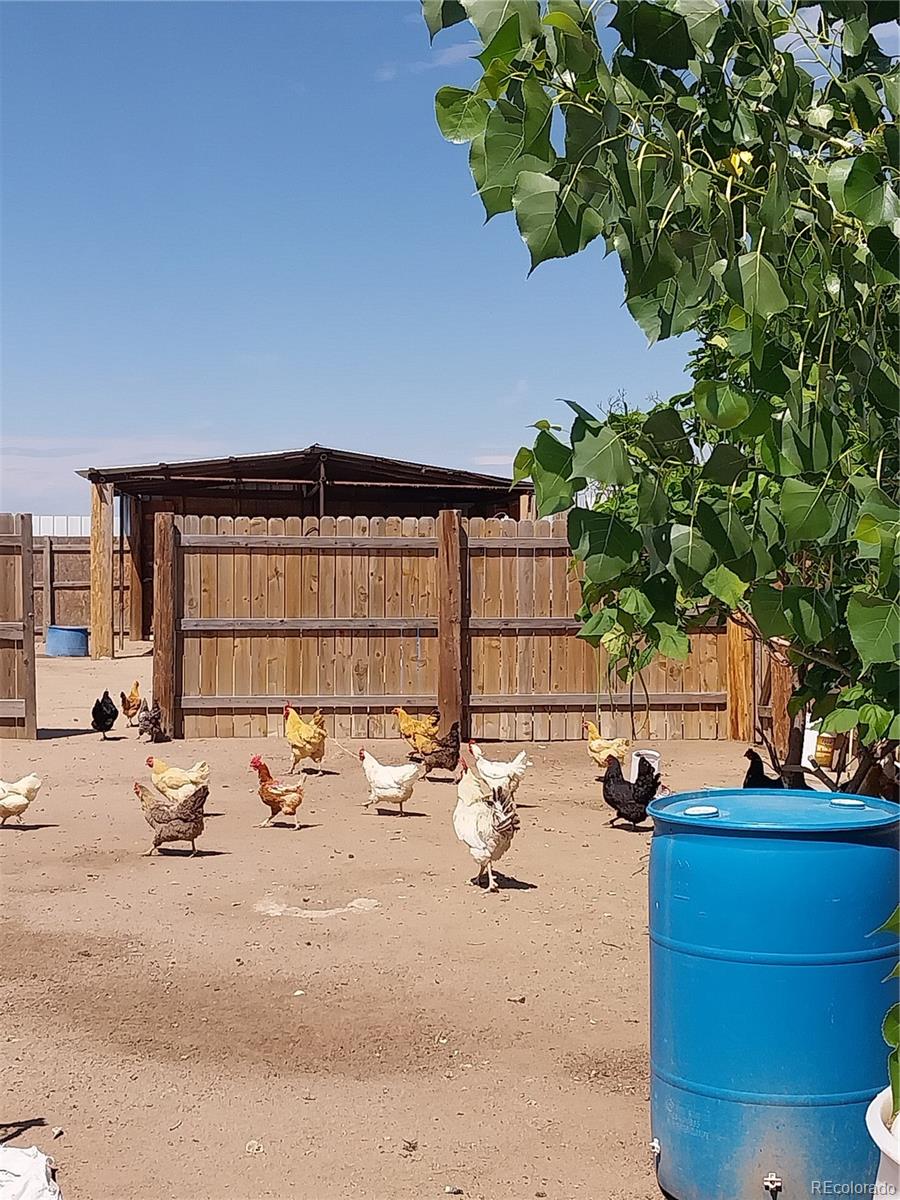 6642 Co Road Wiggins, CO 80654 - Photo 11 of 17 a view of a terrace with chairs