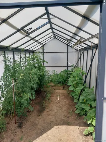 a bed sitting in a room next to a window