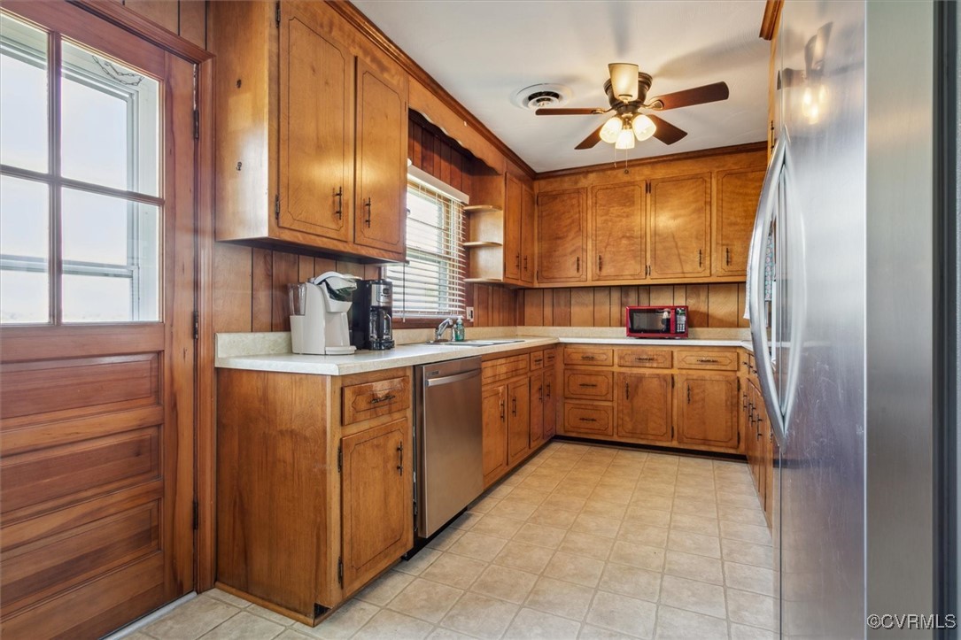 967 Lillys Neck Road Moon, VA 23119 - Photo 16 of 46 a kitchen with stainless steel appliances a sink and cabinets