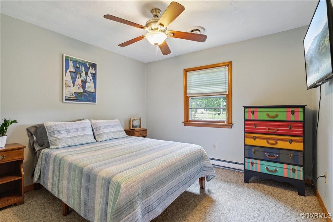 967 Lillys Neck Road Moon, VA 23119 - Photo 28 of 46 a bedroom with a bed and a window