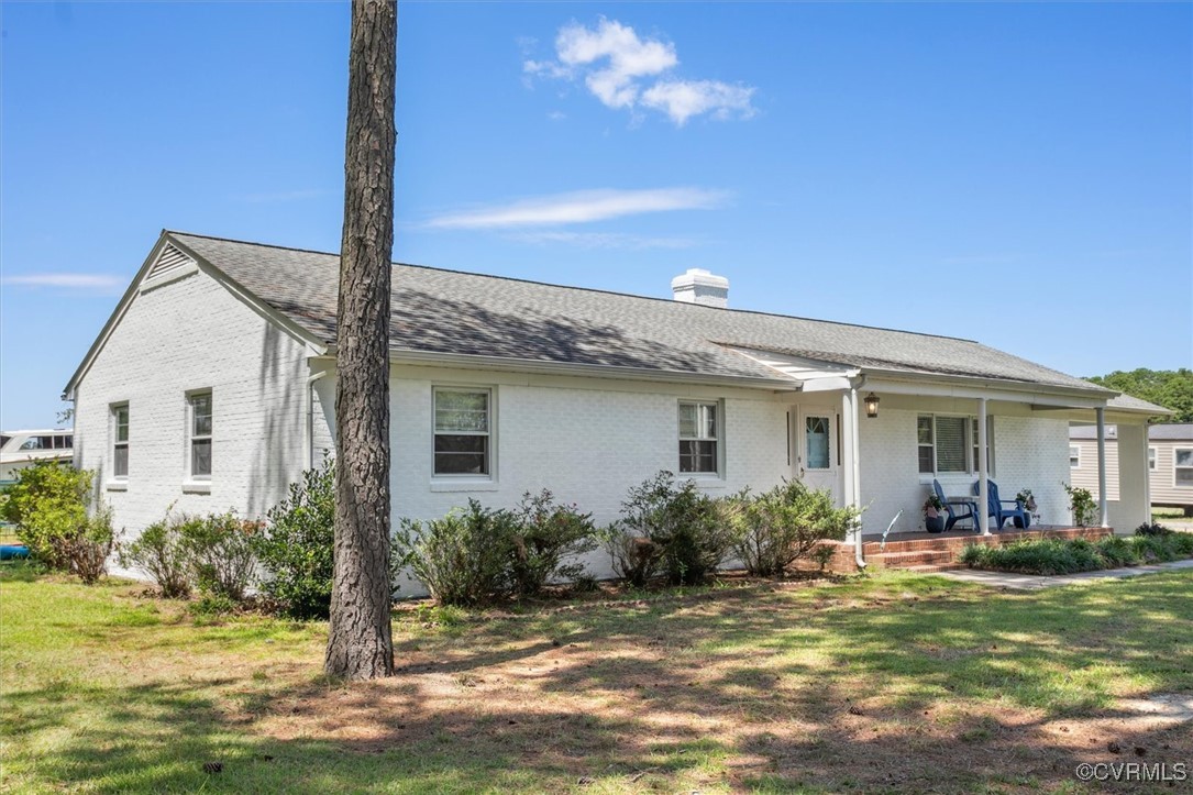 967 Lillys Neck Road Moon, VA 23119 - Photo 4 of 46 a front view of a house with garden