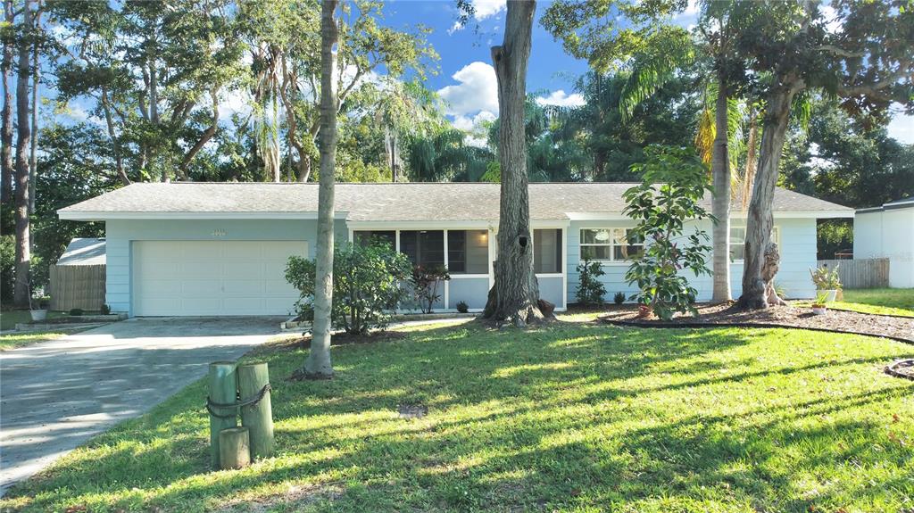 1957 Byram Drive Clearwater, FL 33755 - Photo 1 of 1 a view of a house with backyard and sitting area