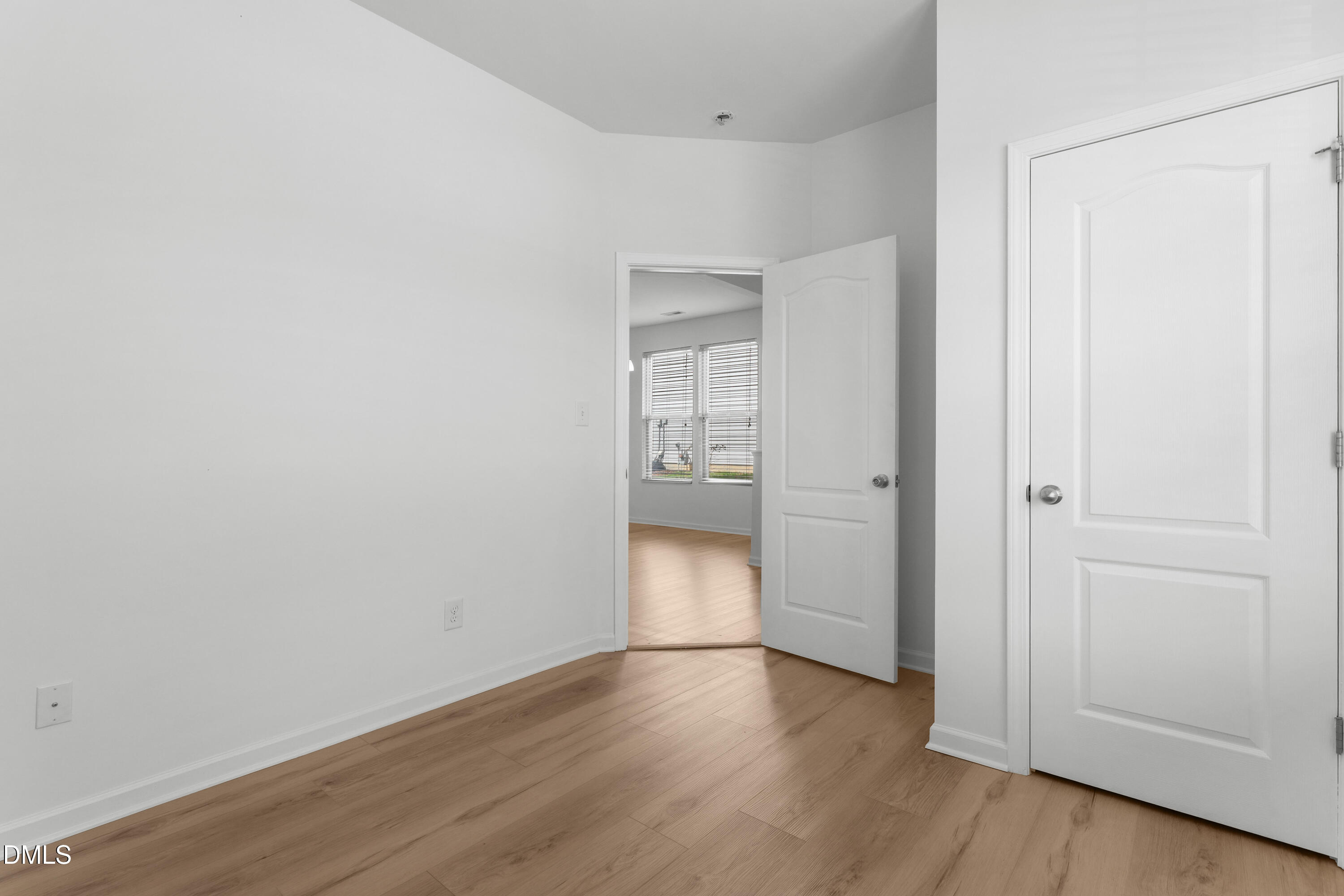 4400 Hillsgrove Road Wake Forest, NC 27587 - Photo 16 of 49 a view of an empty room with wooden floor and closet