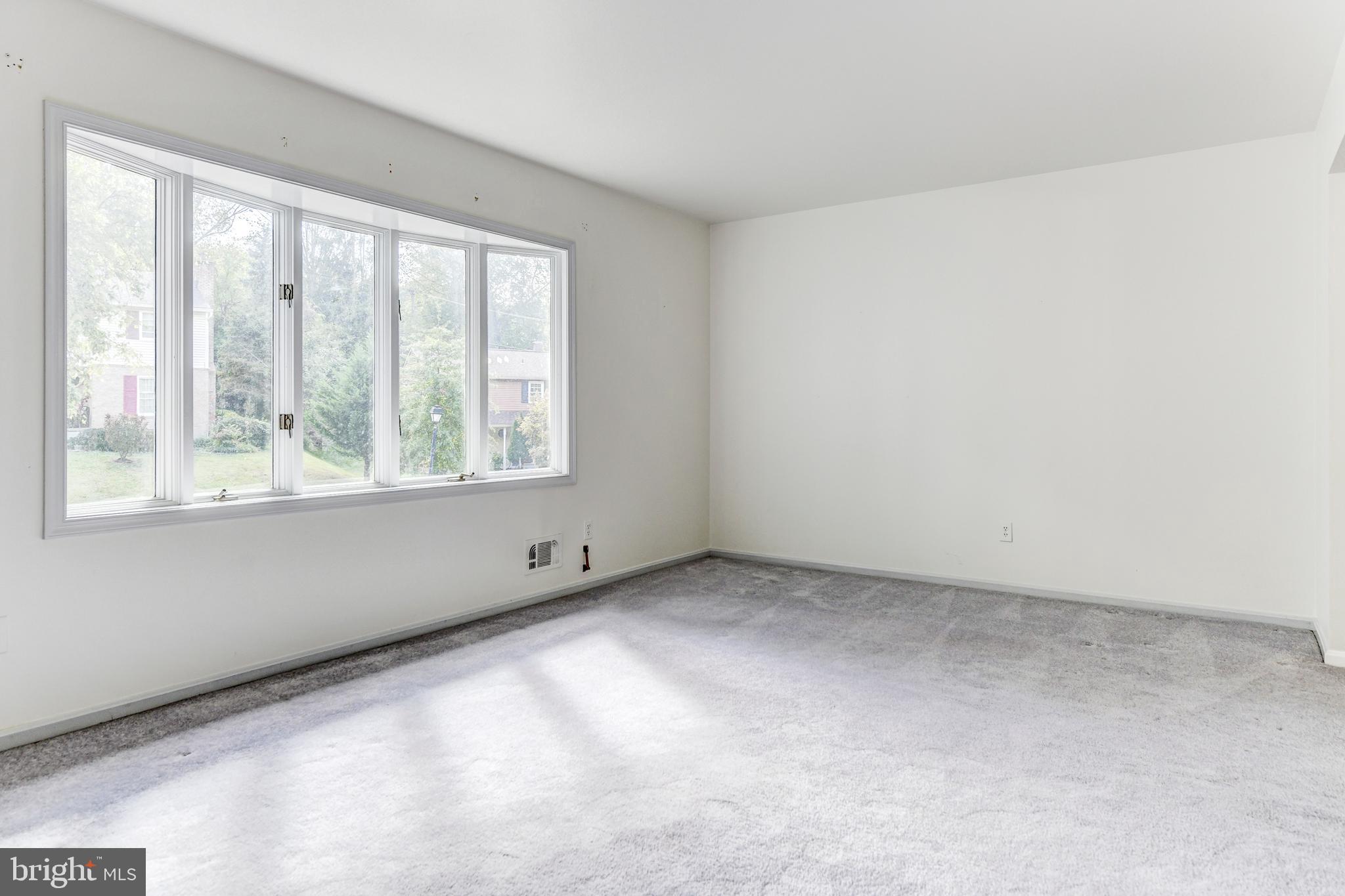 802 Ramshead Circle Cockeysville, MD 21030 - Photo 12 of 33 Bright natural light in the spacious living room