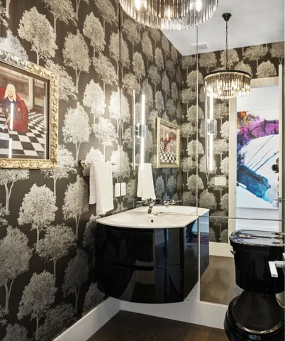 a bathroom with a double vanity sink toilet and shower