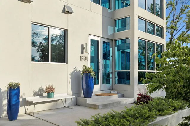 a living room with furniture kitchen view and a flat screen tv