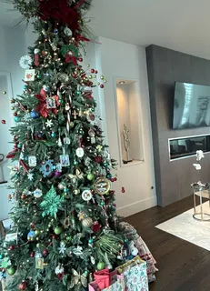 a bathroom with a granite countertop sink a toilet a mirror a vanity and shower