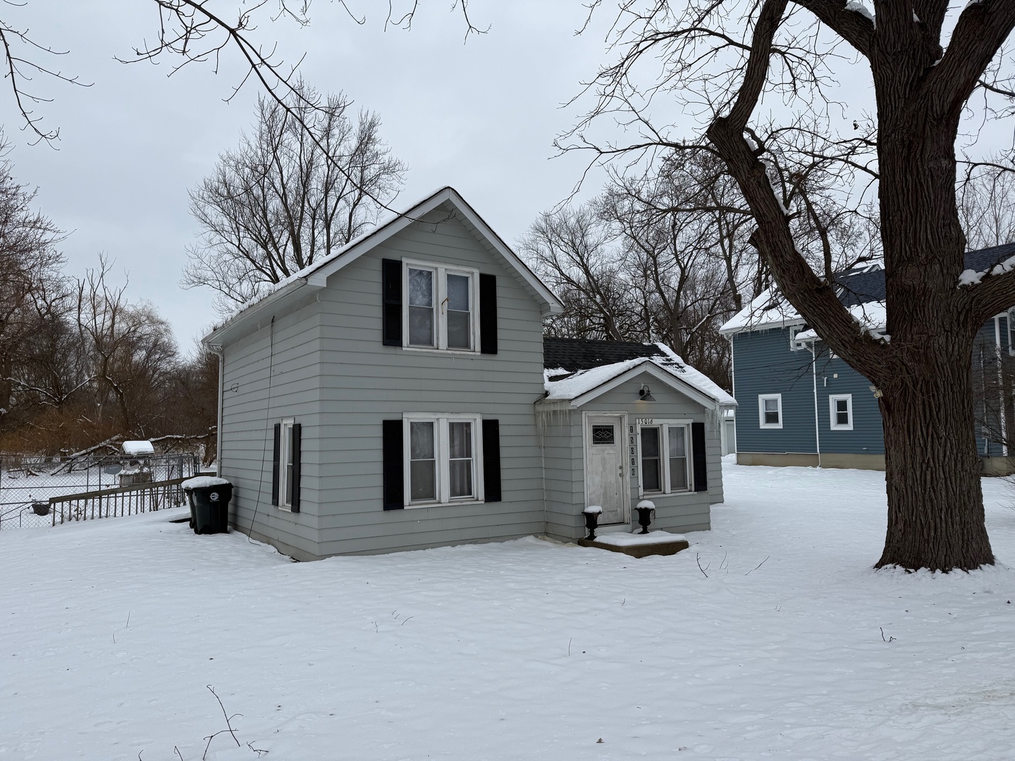 15036 West Russell Road Zion, IL 60099 - Photo 1 of 13 a front view of a house with a yard