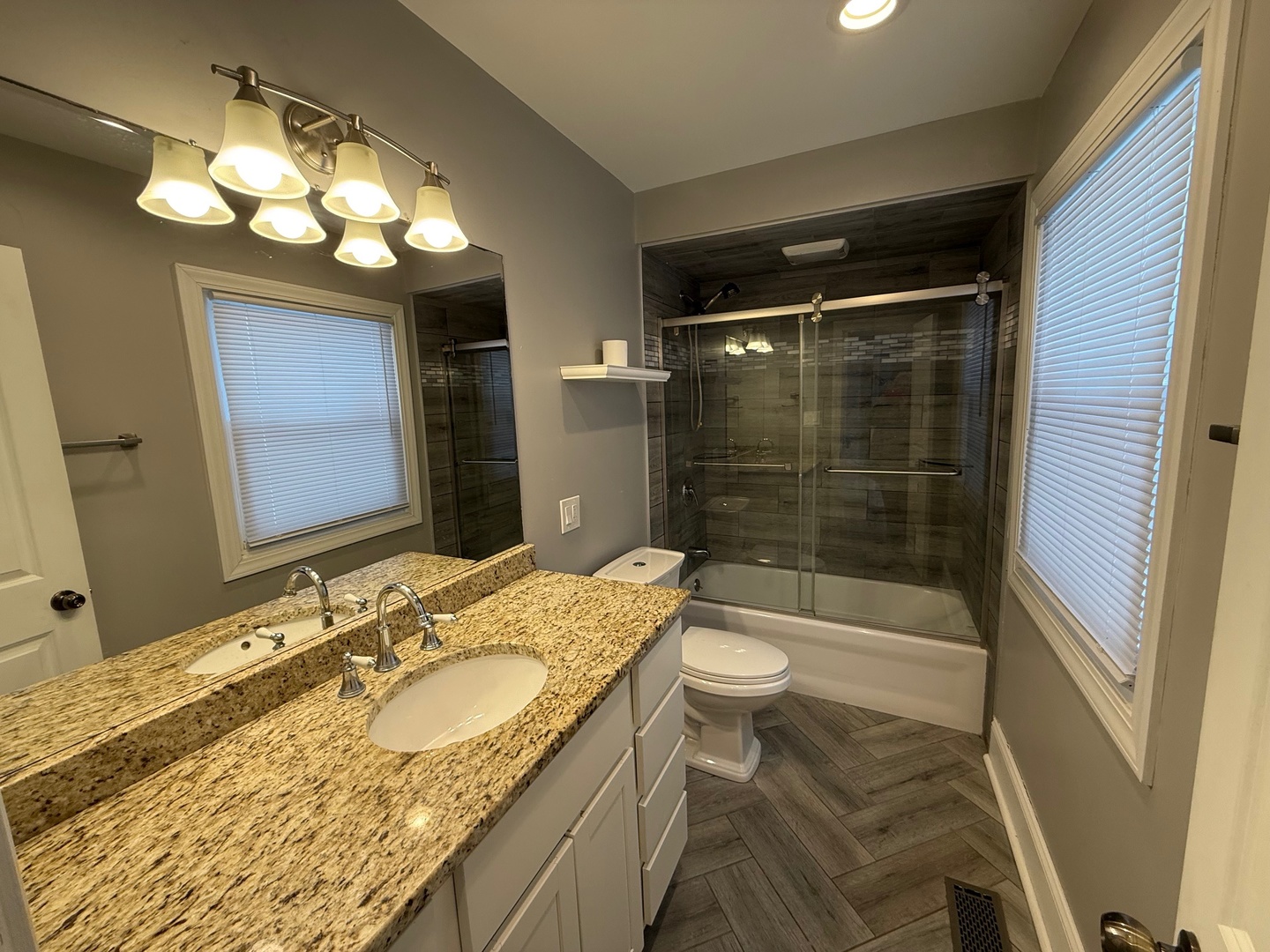 15036 West Russell Road Zion, IL 60099 - Photo 3 of 13 a bathroom with a sink a toilet and shower
