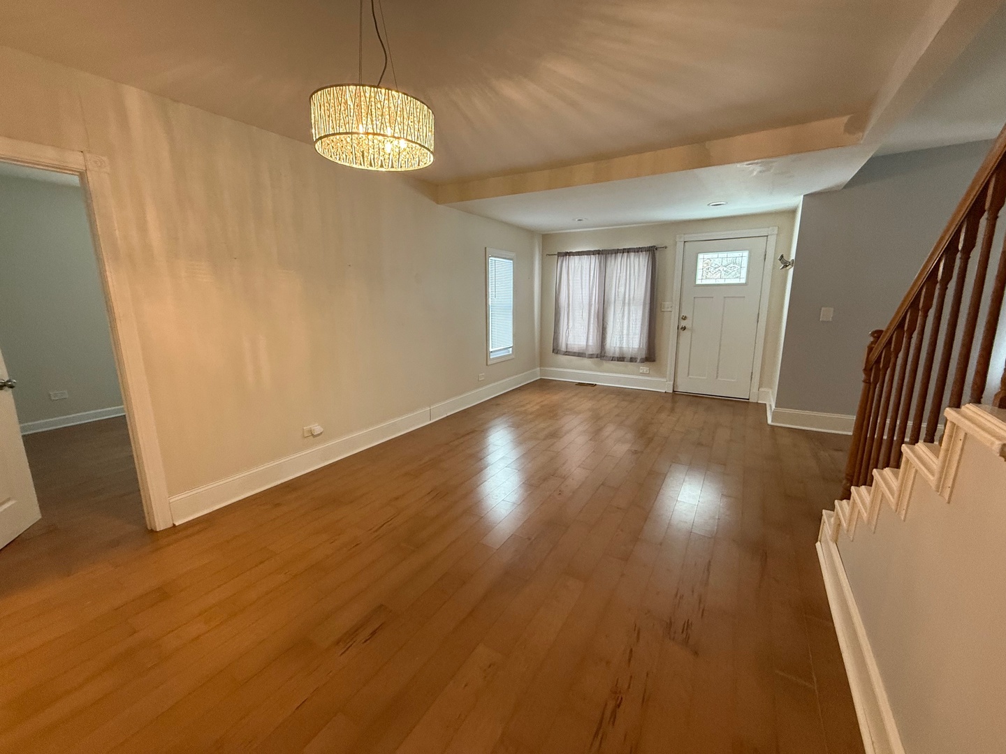 15036 West Russell Road Zion, IL 60099 - Photo 5 of 13 a view of an empty room with wooden floor and a window