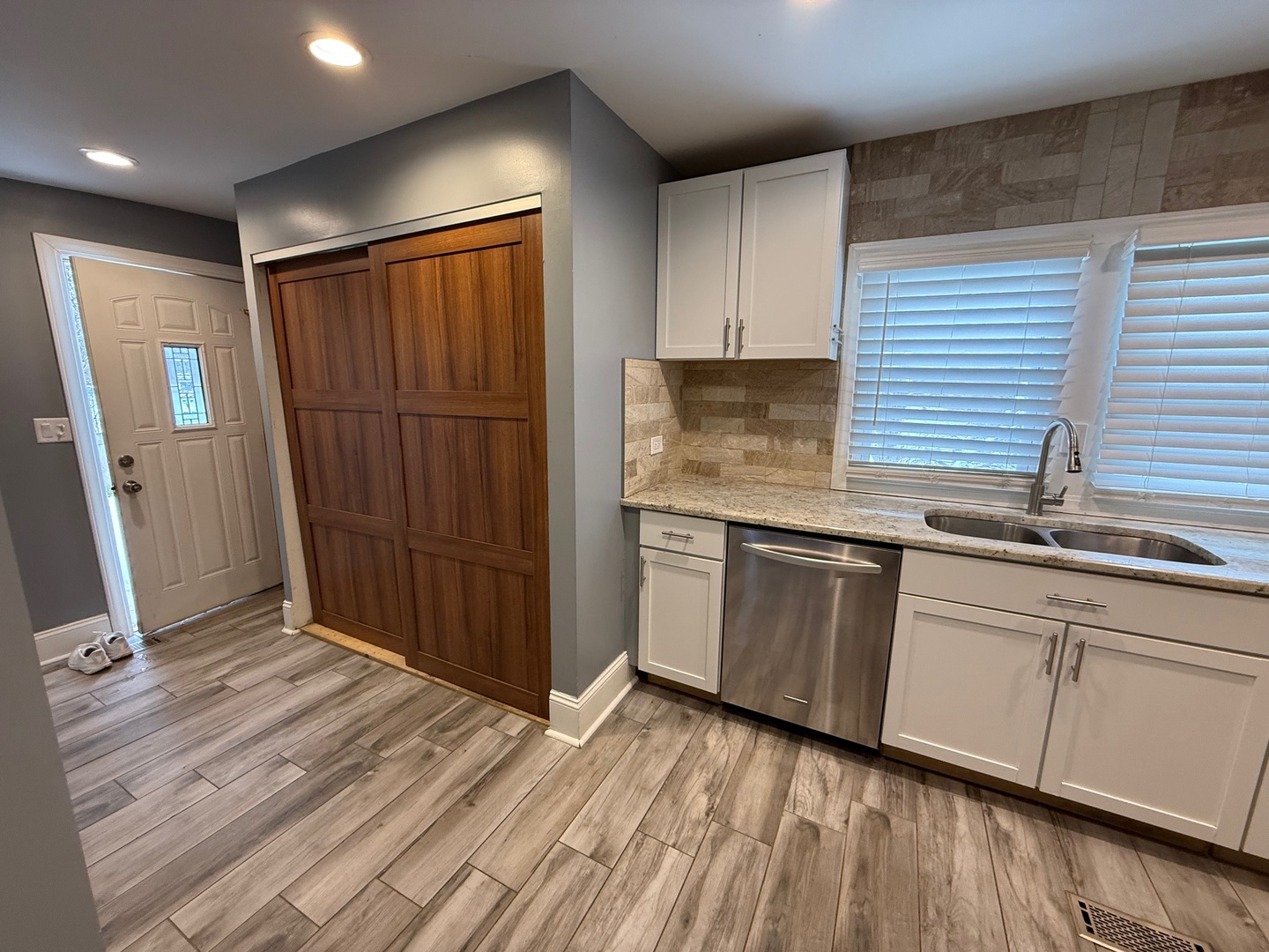 15036 West Russell Road Zion, IL 60099 - Photo 6 of 13 a kitchen with a sink and wooden cabinets