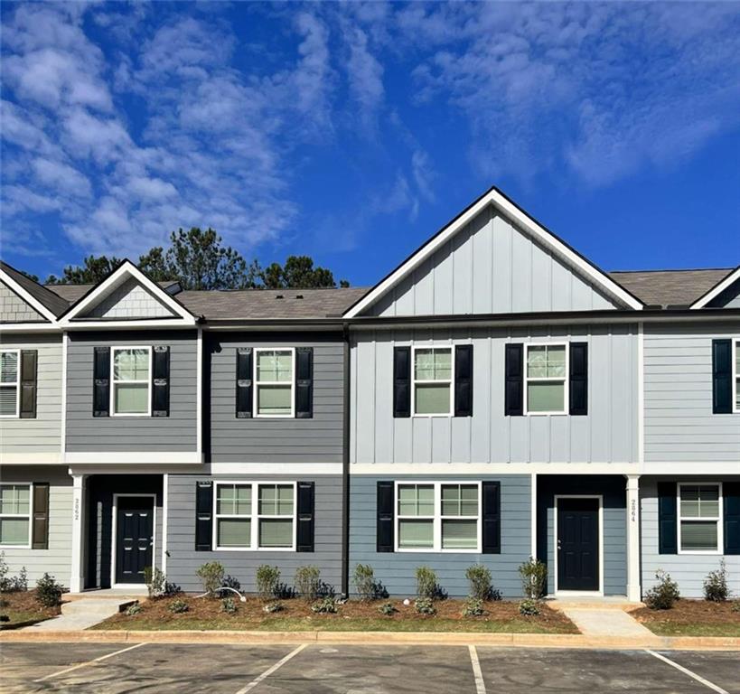 2881 Saratoga Lake View, Unit 33 Decatur, GA 30034 - Photo 1 of 1 a front view of a house with a yard