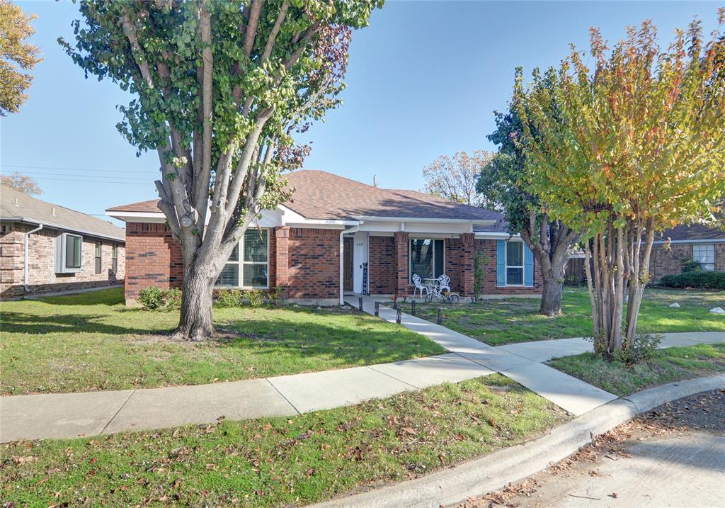 669 Thompson Drive Coppell, TX 75019 - Photo 1 of 1 a front view of a house with a yard