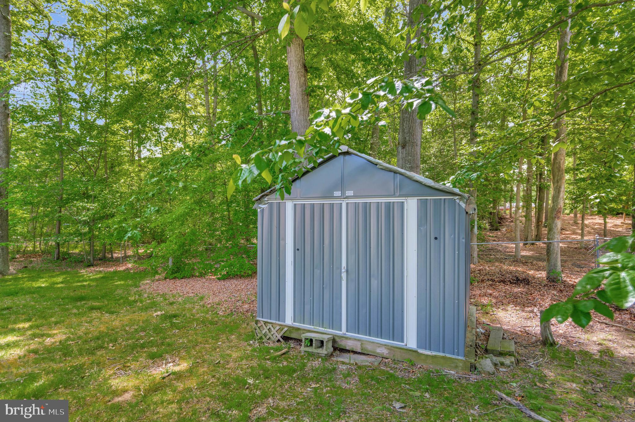216 Manning Road East Accokeek, MD 20607 - Photo 31 of 32 a house view with a wooden fence