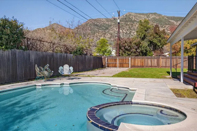 a view of a swimming pool with a patio