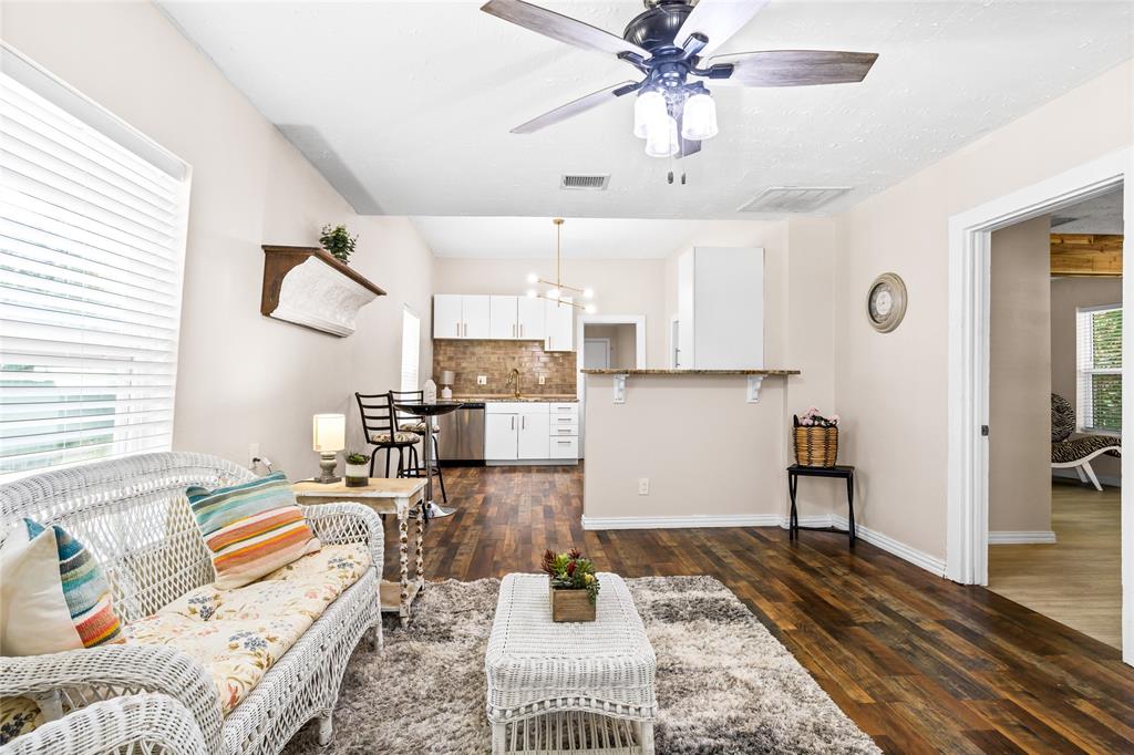 614 Rice Street Denison, TX 75020 - Photo 2 of 22 The warmth of the dark wood flloors combined with the warm neutrals make this home feel and live "comfortable."