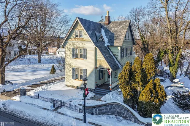 a view of house with yard