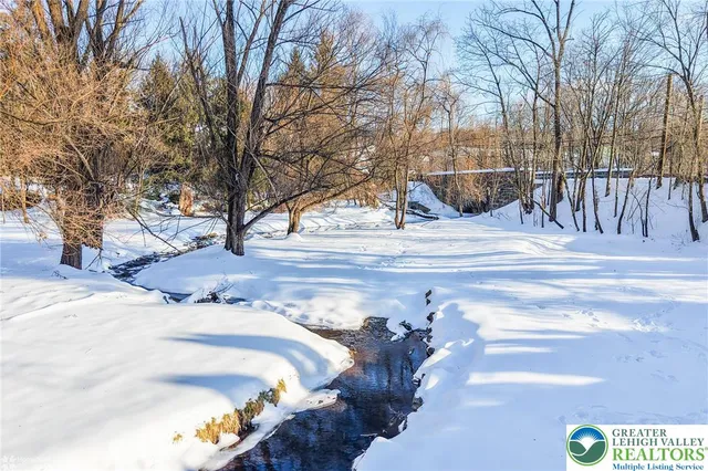 a view of a balcony with wooden floor and fence