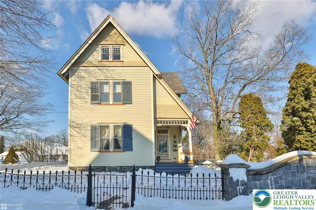 a view of a livingroom with furniture window and wooden floor