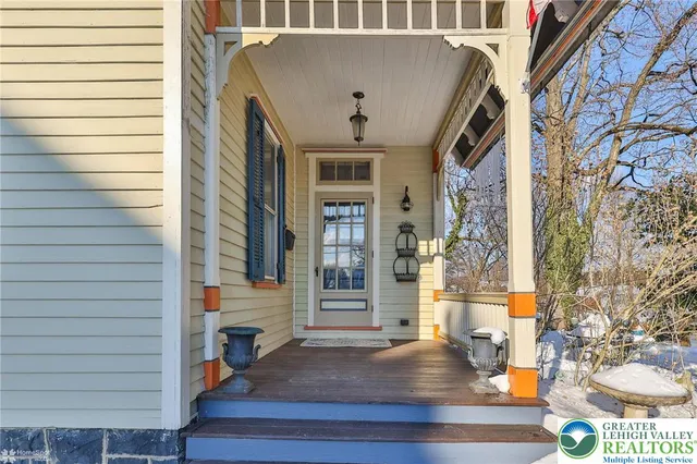 a view of a dining room with furniture and window