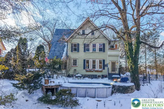 a view of a patio with iron fence