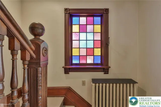 a living room with furniture a window and a chandelier