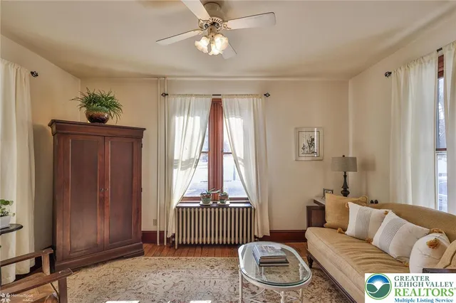 a view of a livingroom with furniture and workspace
