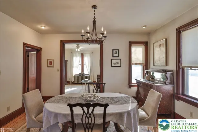 a kitchen with stainless steel appliances a stove a sink a refrigerator cabinets and a counter top space