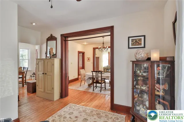 a view of a hallway view with wooden floor and staircase