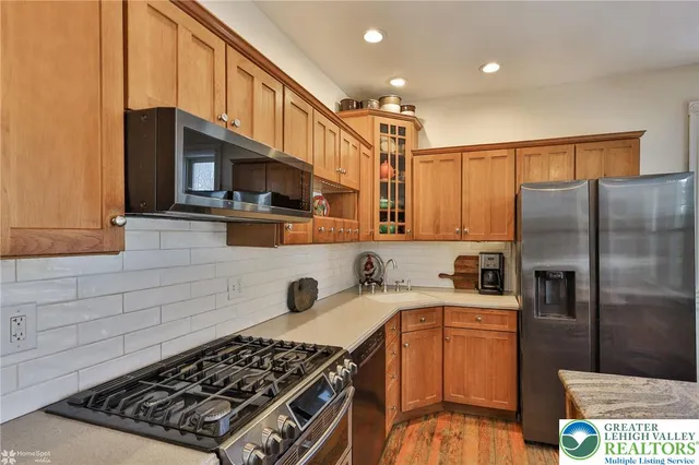 a large bedroom with a bed and a chandelier