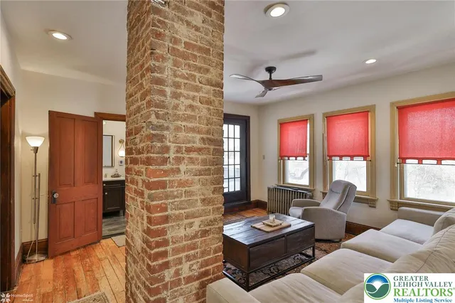 a bathroom with a sink a vanity a mirror and a shower