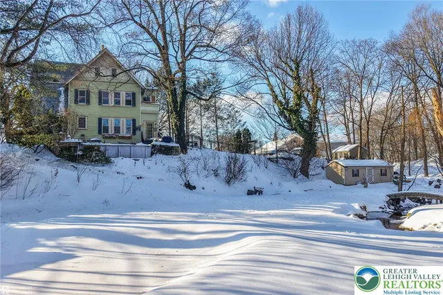 a front view of a house with parking area