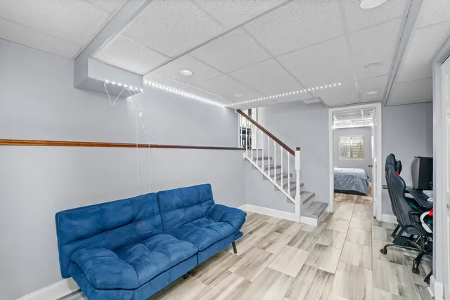 a living room with furniture and a rug