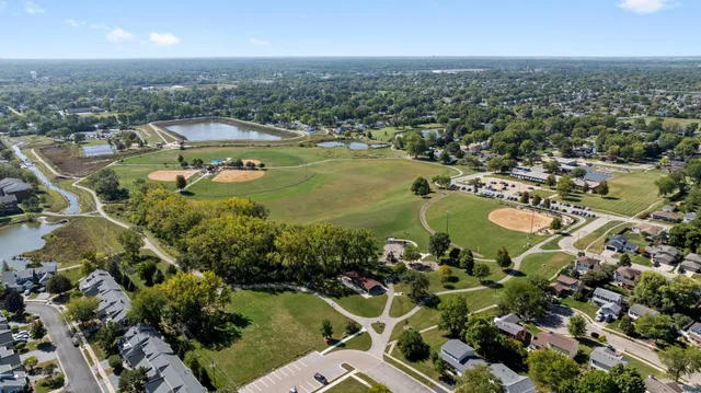 an aerial view of residential houses with outdoor space
