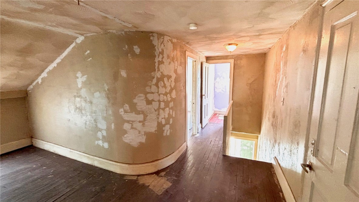 73 West Main Street Le Roy, NY 14482 - Photo 18 of 32 Upstairs sitting area. Back stairs lead to kitchen