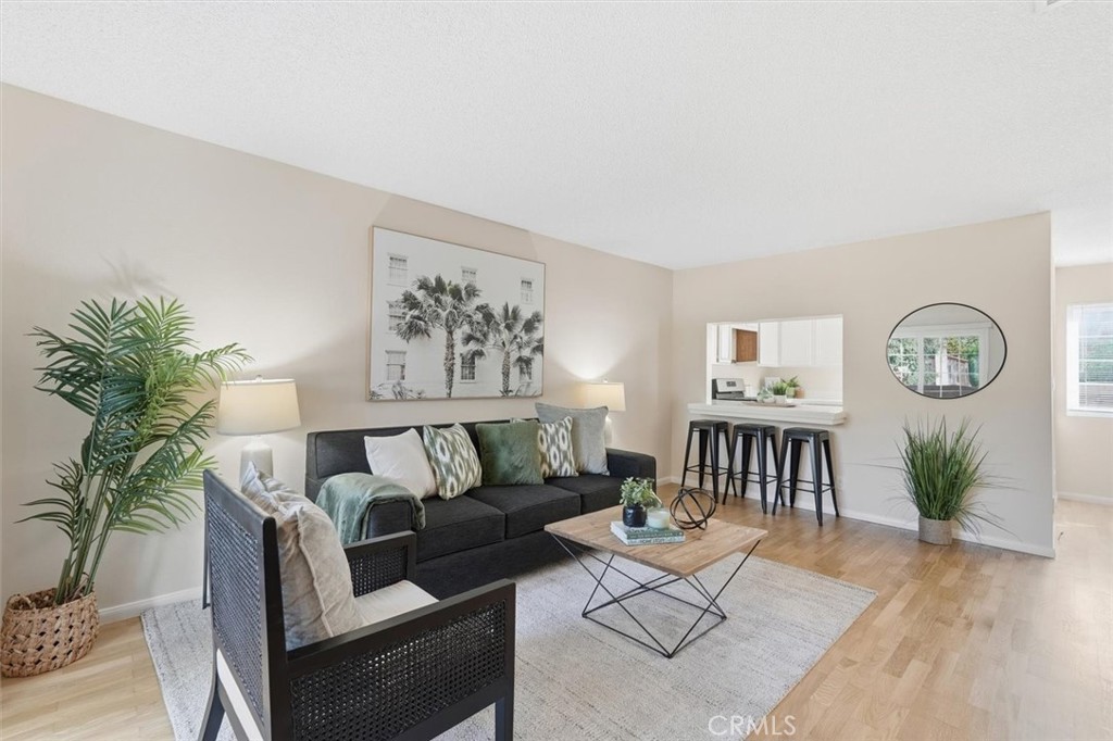 3101 Plaza Del Amo, Unit 8 Torrance, CA 90503 - Photo 1 of 31 a living room with furniture a rug and a wall painting